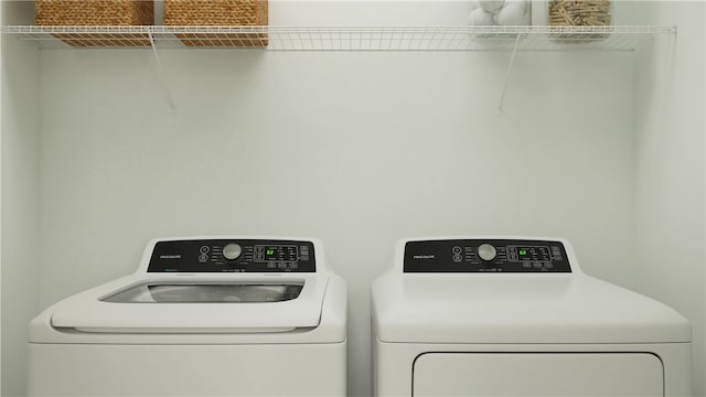 clothes washing area with independent washer and dryer