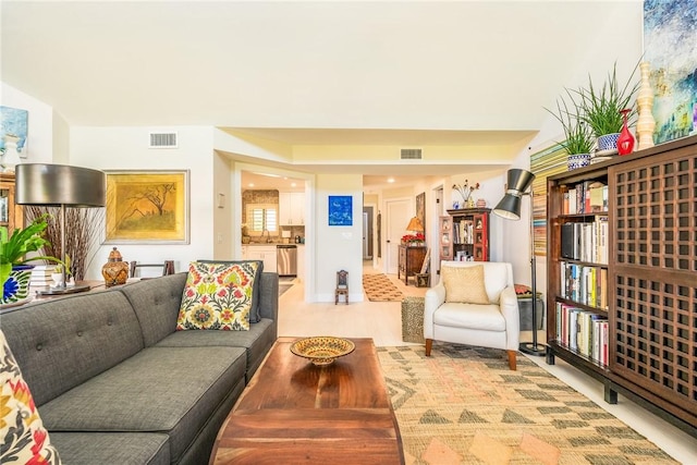 living room featuring visible vents