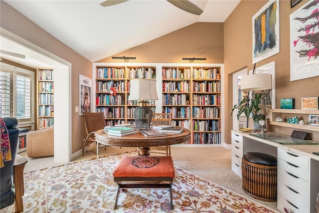 living area featuring vaulted ceiling, carpet, baseboards, and ceiling fan