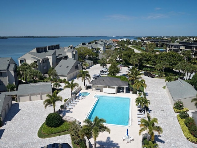 birds eye view of property with a residential view and a water view