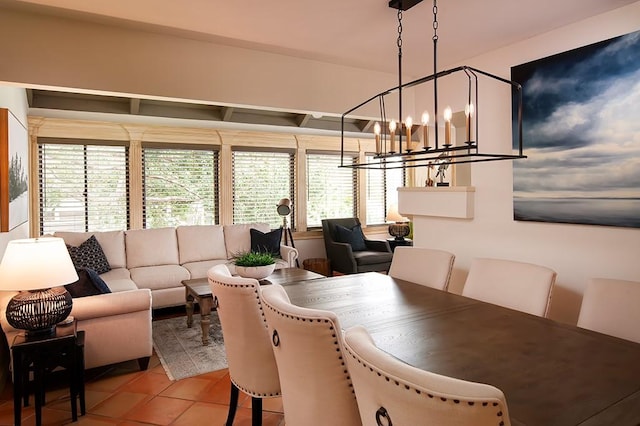 110 Amy Ann Ln, Vero Beach, FL 32963 - tiled dining room featuring a chandelier and healthy amount of natural light