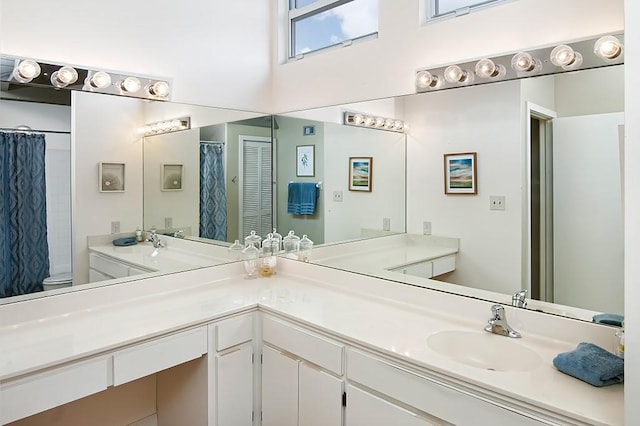 110 Amy Ann Ln, Vero Beach, FL 32963 - bathroom with vanity, toilet, a shower with shower curtain, and a high ceiling