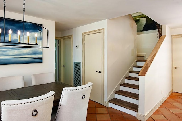 110 Amy Ann Ln, Vero Beach, FL 32963 - dining room with tile patterned floors and stairway