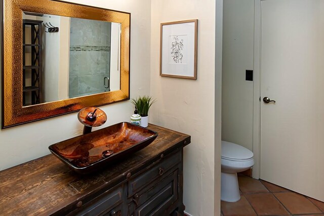 110 Amy Ann Ln, Vero Beach, FL 32963 - bathroom featuring toilet, vanity, and tile patterned floors