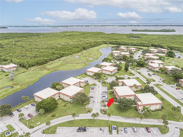 bird's eye view with a water view and a residential view