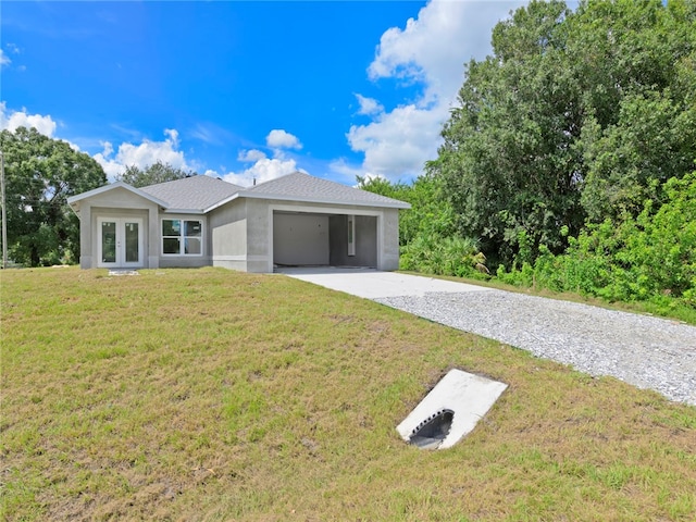 ranch-style home with french doors and a front lawn