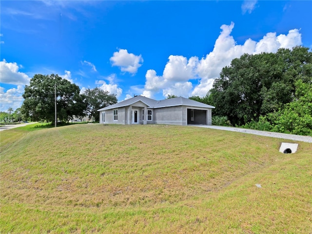 single story home with a garage and a front yard