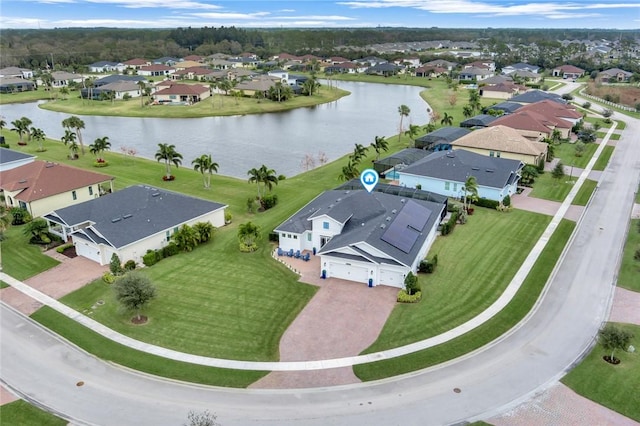 birds eye view of property featuring a residential view and a water view