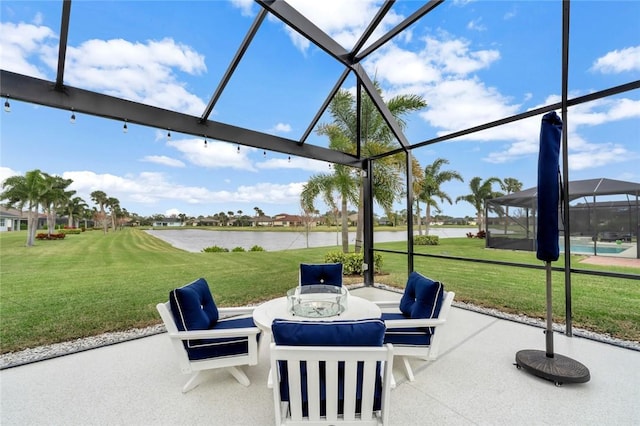 view of patio / terrace with glass enclosure and a water view