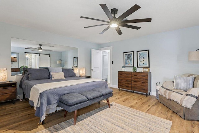 9830 Oak Trl, Sebastian, FL 32976 - bedroom featuring light wood finished floors and a ceiling fan