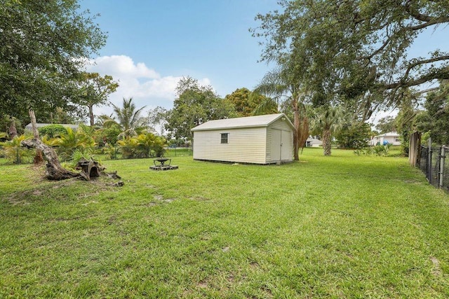 9830 Oak Trl, Sebastian, FL 32976 - view of yard with a storage unit and a fire pit