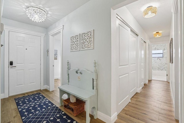 9830 Oak Trl, Sebastian, FL 32976 - foyer with light wood-style floors and baseboards