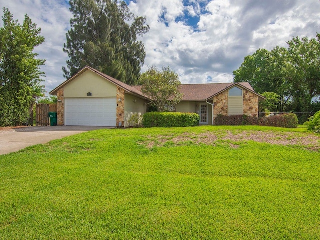 single story home with a front yard and a garage