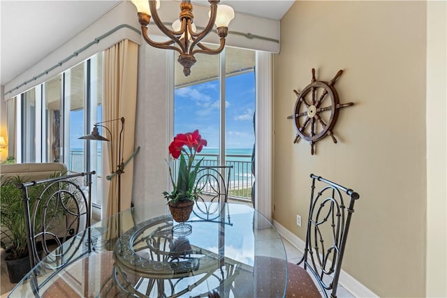 3000 N Aia Hwy N Phgc, Phgc, Hutchinson Island, FL 34949 - dining area featuring a water view, baseboards, and a chandelier
