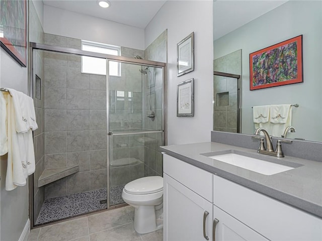 bathroom with vanity, an enclosed shower, tile patterned floors, and toilet