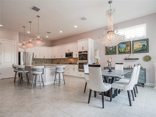 tiled dining room featuring a notable chandelier