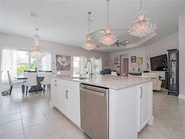 kitchen featuring a center island with sink, sink, stainless steel dishwasher, and white cabinets