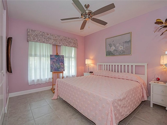 bedroom with light tile patterned floors and ceiling fan