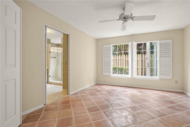 tiled empty room with ceiling fan