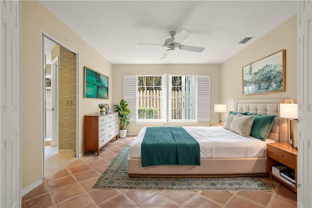 bedroom with ceiling fan and light tile patterned floors