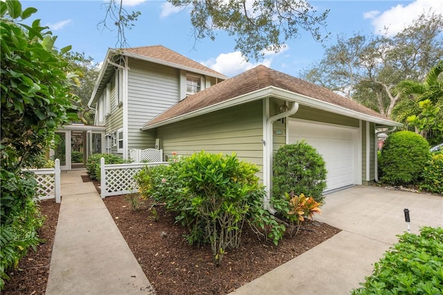 view of side of property featuring a garage