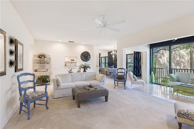 5151 A1A Hwy Unit 506, Indian River Shores, FL 32963 - living area featuring a ceiling fan, carpet flooring, and a chandelier