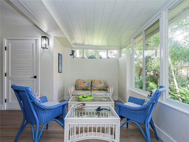 sunroom featuring wood ceiling