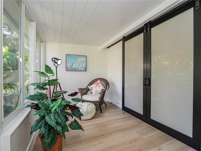 sunroom / solarium featuring wooden ceiling