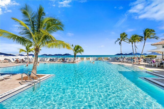 view of pool with a water view