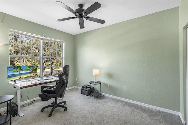 office area with ceiling fan and carpet flooring