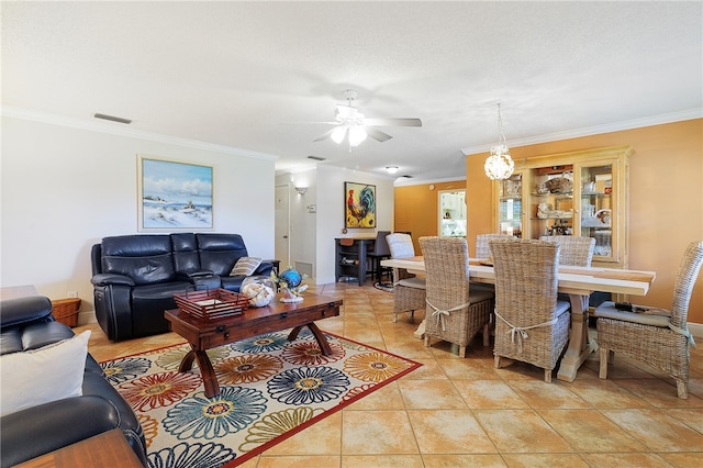 living room with light tile patterned floors, ceiling fan, and crown molding