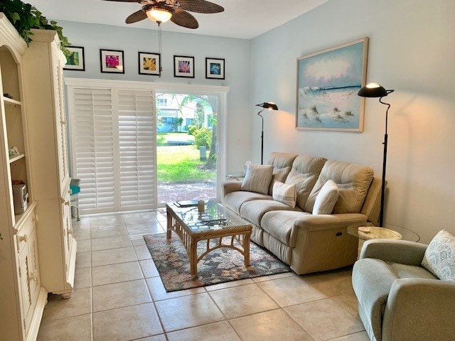 living room with light tile patterned floors and ceiling fan