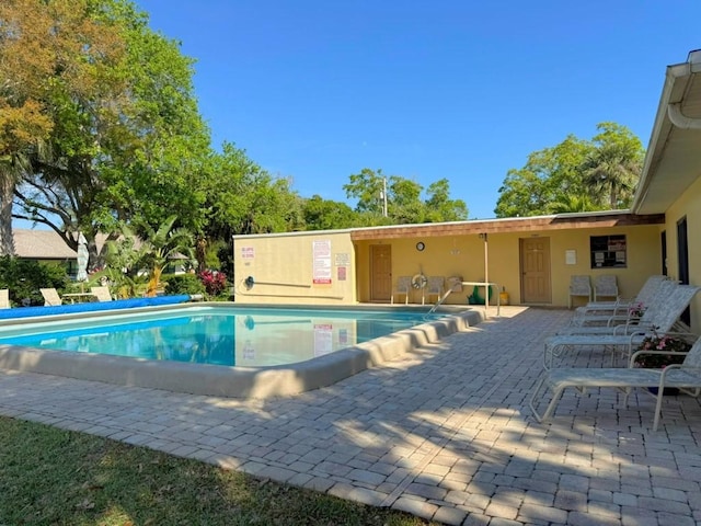 pool with a patio