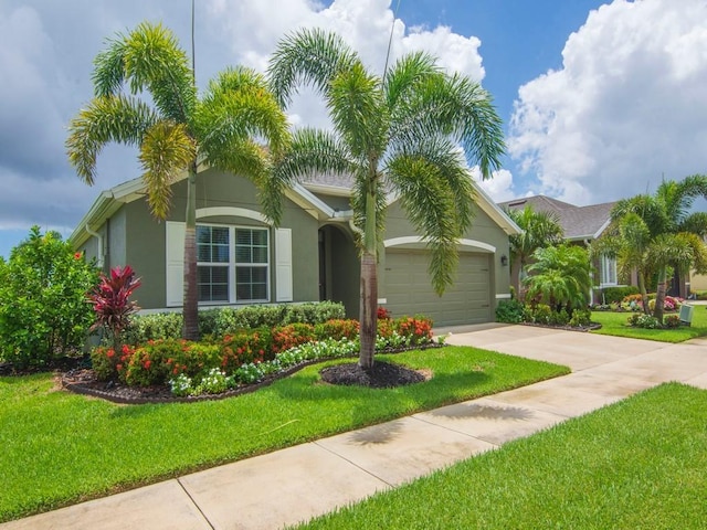 view of front facade featuring a garage and a front yard