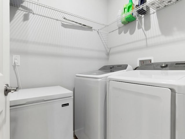 washroom with separate washer and dryer