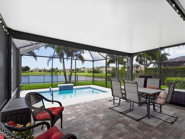 view of swimming pool with a water view, a lanai, and a patio