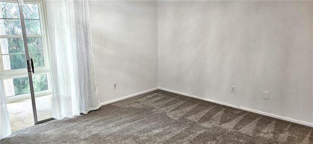 unfurnished room with plenty of natural light and carpet