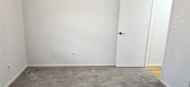 spare room with light colored carpet