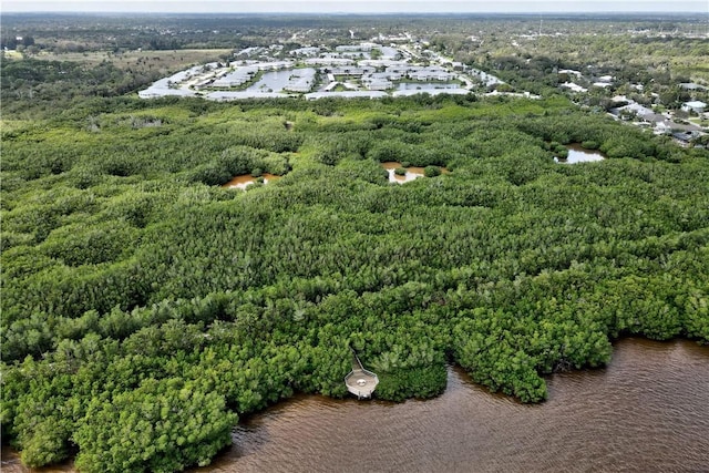 217 Grove Isle Cir Unit 217, Vero Beach, FL 32962 - drone / aerial view featuring a water view and a view of trees