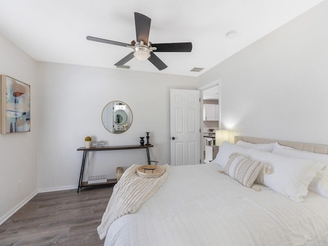 bedroom with dark wood-type flooring and ceiling fan