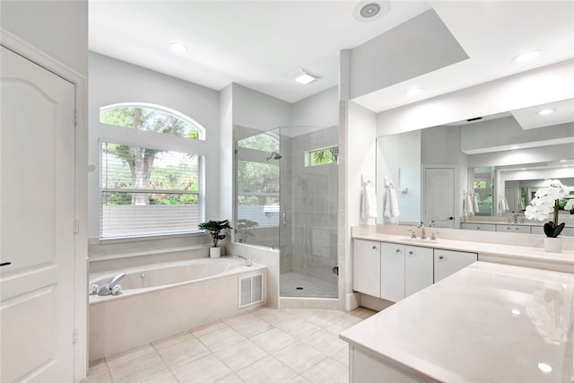 bathroom with a garden tub, visible vents, a shower stall, vanity, and tile patterned floors