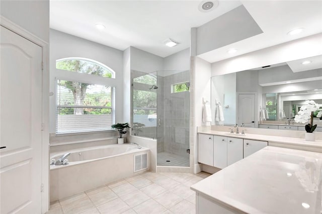 bathroom with visible vents, a garden tub, tile patterned flooring, vanity, and a shower stall