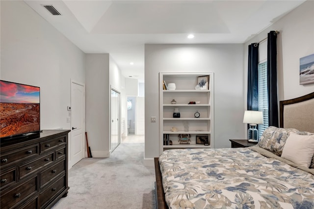 bedroom with baseboards, visible vents, light colored carpet, a tray ceiling, and recessed lighting