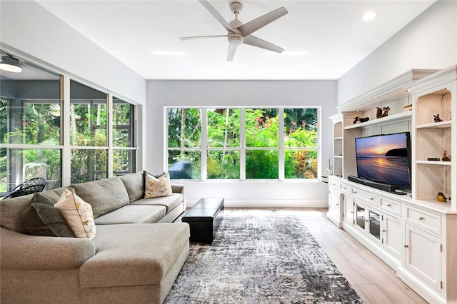 living room with ceiling fan, light wood-style flooring, and recessed lighting