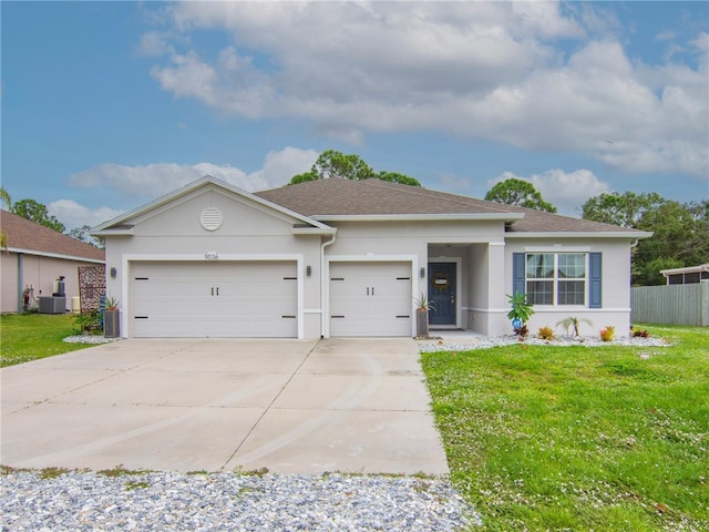 single story home with a front yard, central AC, and a garage