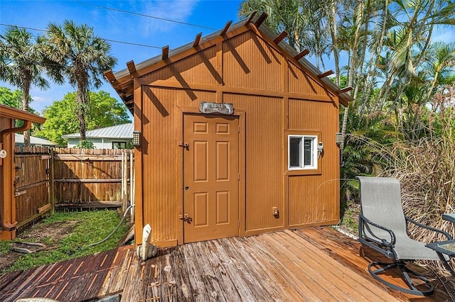 view of shed featuring fence