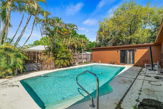 view of swimming pool with a patio, a fenced backyard, and a fenced in pool