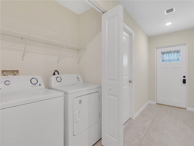 laundry room with washer and clothes dryer