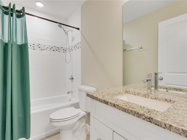 full bathroom featuring shower / tub combo, vanity, and toilet