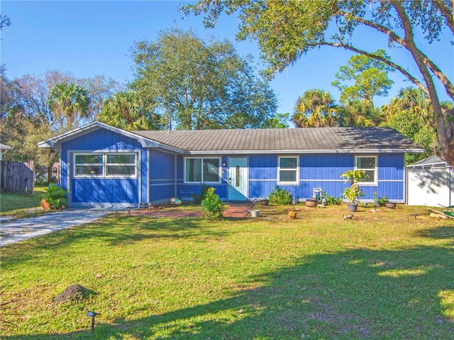 ranch-style home featuring a front yard